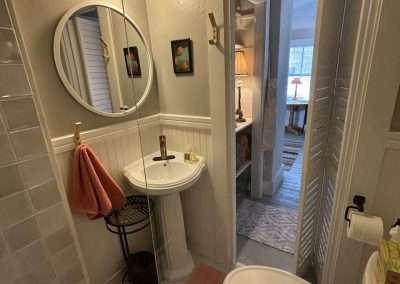 Updated bathroom with vanity space just outside the door.