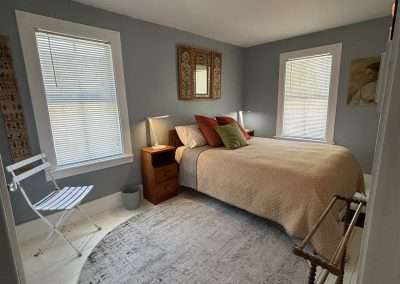 Bedroom with full size bed, reading lights with USB plugs. This is the largest bed we could comfortably fit into the bedroom.