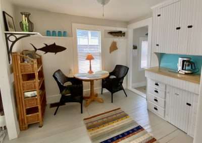 Dining area is in the kitchenette, nice lighting and comfortable spot for morning coffee.